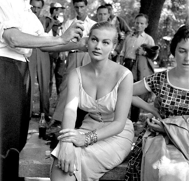 Anita Ekberg has her hair styled on a movie set, Rome, Italy, 1956