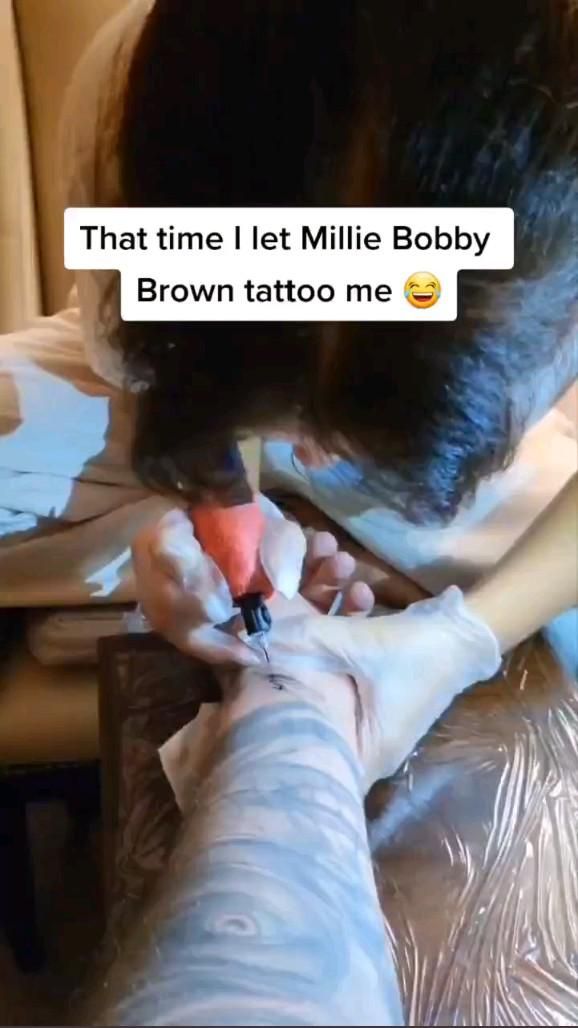 Millie Bobby Brown Tattooing &Quot;011&Quot; To Gordon James.