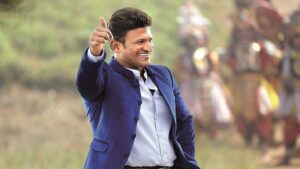 Smiling Puneeth Rajkumar Is Showing Thumbsup Wearing White Blue Coat Suit Puneet HD Wallpaper